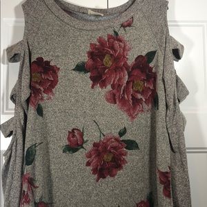 Sweater with cut outs in sleeve